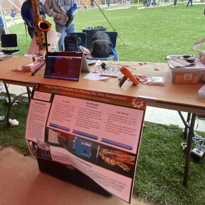 Exhibit booth at the 2023 Engineering Open House showing the breadboarded EMG circuit on the right side of the table